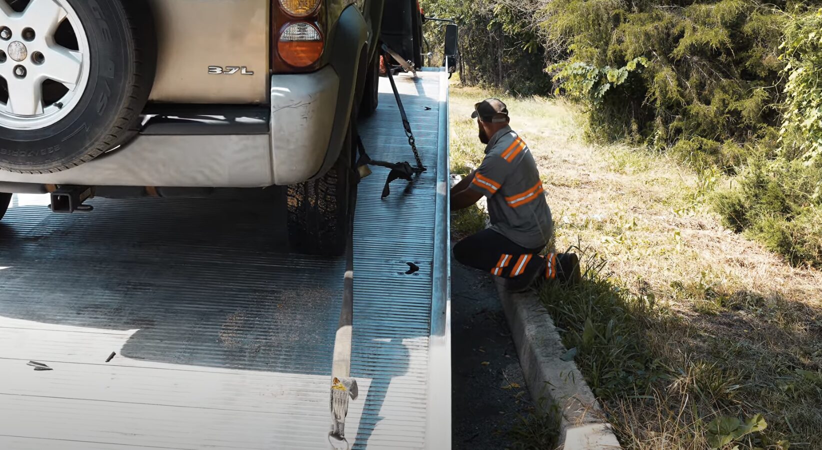 Roadside assistance technician helping with vehicle recovery